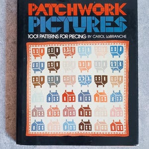 May include: A hardcover book titled PATCHWORK PICTURES 1001 PATTERNS FOR PIECING BY CAROL LABRANCHE. The black cover features a central illustration of a quilt with a grid of small house motifs in shades of blue, brown, orange, and cream.