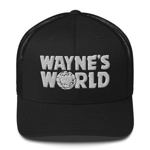 May include: Black trucker cap featuring the embroidered text "WAYNE'S WORLD" in white, with a globe graphic. The cap has a mesh back and a curved peak.