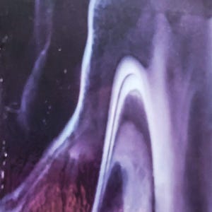 May include: An abstract surface featuring a fluid, marbled pattern with deep shades of purple and violet transitioning into bright, stark white streaks that curve and flow across the composition in a smooth, organic, and continuous design.
