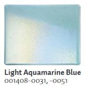 May include: A rectangular, light aquamarine blue glass tile. The tile has a glossy finish and a subtle gradient of color. The text "Light Aquamarine Blue" is printed at the bottom, along with the product codes.
