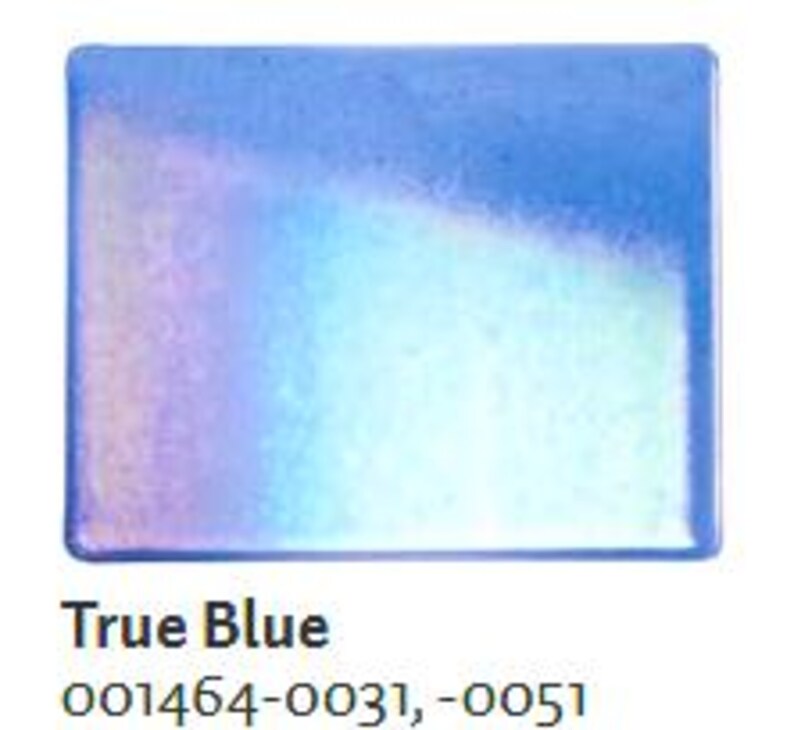 May include: A rectangular, iridescent True Blue soap dish. The dish has a gradient of colors, transitioning from a deep blue to a light blue and white. The text "True Blue" is printed in black at the bottom of the image.