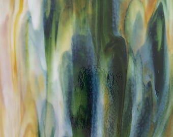 May include: Abstract art featuring a blend of green, blue, and yellow colors in a swirling, fluid pattern. The colors are vibrant and create a sense of movement.