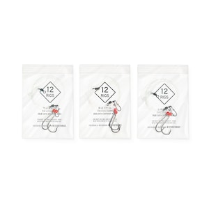 May include: Three clear plastic bags each containing fishing rigs. Each bag has a white label with the text "12 RIGS" inside a black diamond. Below the diamond is text that reads "2/0 CIRCLE HOOKS 30LB SUFIX SUPERIOR".