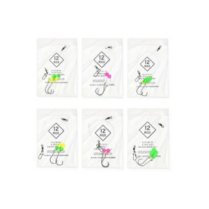 May include: Six clear plastic bags of fishing rigs, each containing a hook, line, and a brightly colored float. Each bag has a label with the number "12" and the word "RIGS". The floats are in various colors, including green, pink, and yellow.