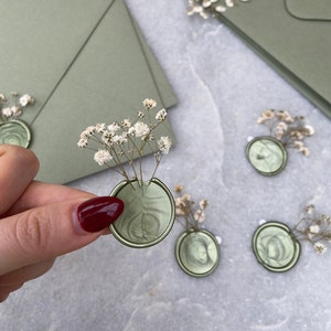 Peel and stick green wax seals with dried gypsophila