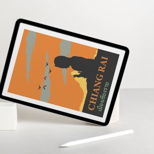 K&ouml;nnte beinhalten: Ein digitales Tablet zeigt ein Grafikdesign mit einer Silhouette einer Person vor einem Sonnenuntergangs-Hintergrund. Der Text "CHILANG RAI" ist in fetter, gr&uuml;ner Schrift mit der thail&auml;ndischen &Uuml;bersetzung darunter geschrieben. Das Tablet ist auf einem wei&szlig;en W&uuml;rfel abgest&uuml;tzt.