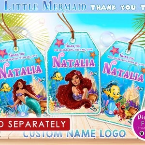 May include: Three Little Mermaid-themed thank you tags with the name "Natalia" in purple. Each tag features a different illustration of Ariel, Flounder, and other sea creatures. The tags have a blue background with the text "Thank you for celebrating with me, love."