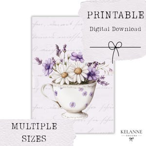 May include: Digital download art print featuring a teacup overflowing with daisies and lavender. The teacup is white with purple floral accents. The background has script writing and the words "PRINTABLE", "Digital Download", and "MULTIPLE SIZES".