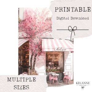 May include: A watercolour print depicting a cafe with a pink and white striped awning and pink chairs. The image includes the text "PRINTABLE Digital Download" and "MULTIPLE SIZES". The artist's name, "KELANNE DESIGNS", is also visible.