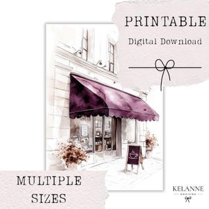 May include: Watercolour print of a cafe with a deep purple awning. The storefront has a display window and a small chalkboard sign with a coffee cup icon. Text on the print reads "PRINTABLE Digital Download" and "MULTIPLE SIZES".