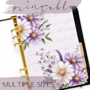 May include: A floral printable planner insert featuring white and purple daisies, lavender, and green foliage. The planner has a gold binder and the text "printable" and "multiple sizes". The design includes a handwritten script background.