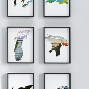 May include: Six framed prints of the Great Lakes, each with a different scenic image inside the outline of the lake. The lakes are labeled: Lake Superior, Lake Michigan, Lake Huron, Lake Erie, Lake Ontario, and Lake St. Clair.