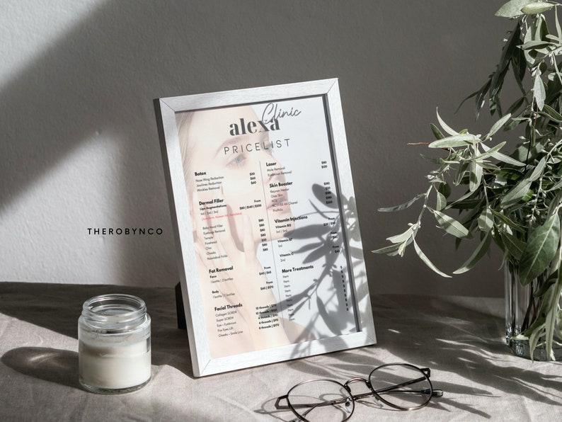 May include: A white framed price list for Alexa Clinic. The price list includes services such as Botox, Dermal Filler, Fat Removal, Facial Threads, Laser, Skin Treatments, and Vitamin Injections.