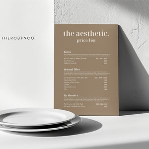 May include: A brown price list for a business called "the aesthetic." The list includes prices for botox, dermal filler, and fat dissolve treatments.