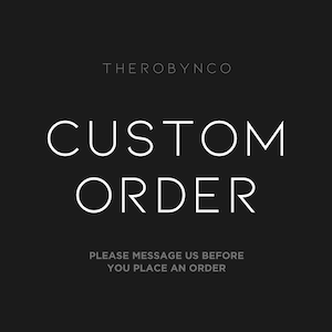 May include: Black and white text on a black background that reads "THEROBYNCO CUSTOM ORDER PLEASE MESSAGE US BEFORE YOU PLACE AN ORDER"