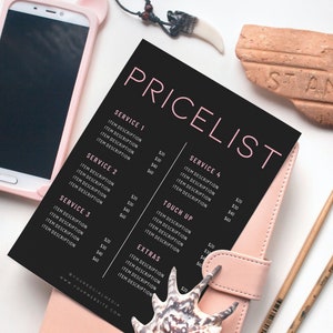 May include: A black and pink pricelist with item descriptions and prices, lying on a pink leather notebook. A smartphone in a pink case, paintbrushes, and decorative items are also present.