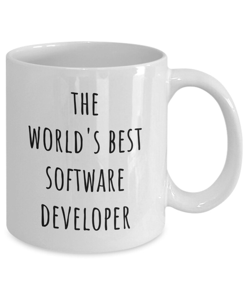 May include: White ceramic mug with a curved handle. The mug features the text "THE WORLD'S BEST SOFTWARE DEVELOPER" in black, centered on the front. A simple, everyday coffee mug.