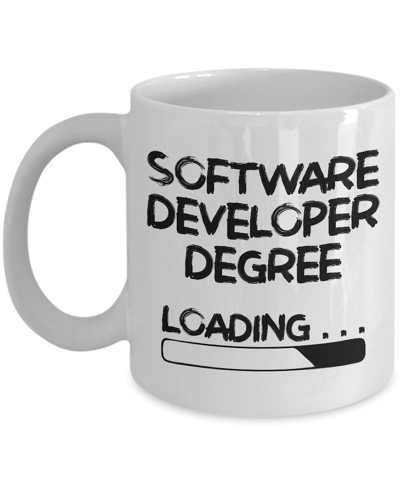 May include: White ceramic coffee mug with black text that reads "Software Developer Degree Loading..." with a progress bar underneath.