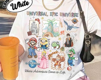 UNIVERSAL Epic UNIVERSE Trip 2026, Epic World Tour 2026, Universal Group Characters Tee, Super Mario Toothless Jurassic Trip Tee