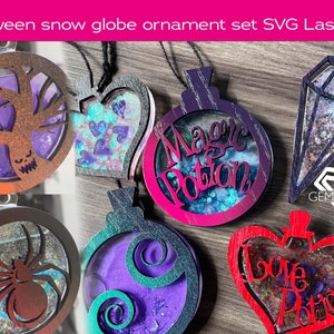 May include: Set of six Halloween-themed snow globe ornaments. The ornaments are made of wood and feature various designs, including a tree, a spider, a heart, a diamond, and two potion bottles. The ornaments are painted in various colors, including red, pink, purple, blue, and green. The ornaments are decorated with glitter and other embellishments.