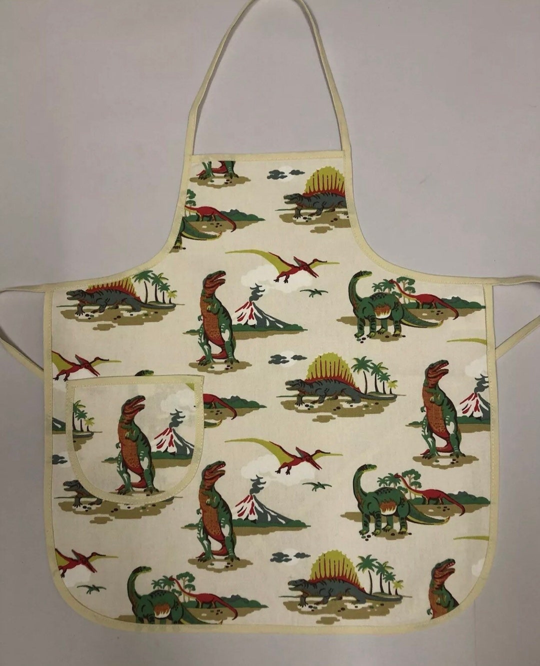 Childs Apron in Cath Kidston Dinosaur Print Soft Pvc Coated Cotton