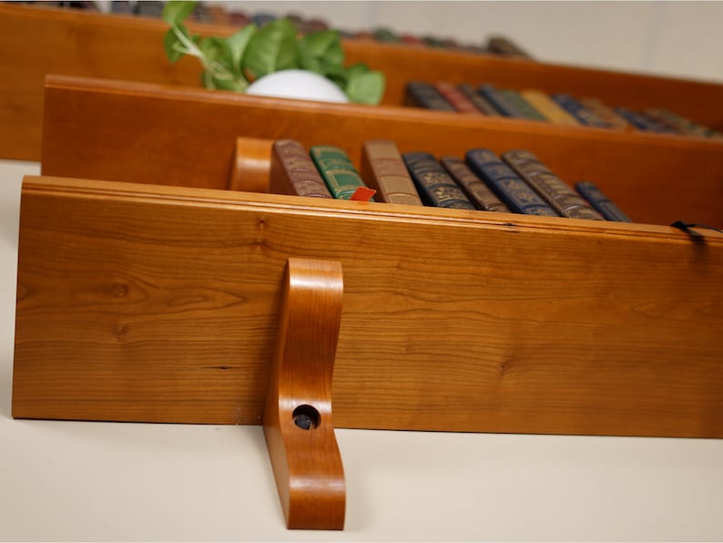 Detail shot of shelves from the bottom lefthand corner showing off the grain of the wood.