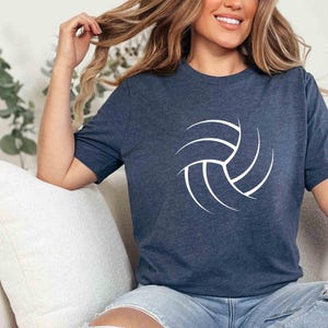 May include: A navy blue t-shirt with a white volleyball graphic. The shirt is made of a soft, comfortable material.
