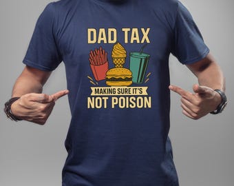 May include: Navy blue t-shirt with a graphic design featuring the text "DAD TAX" above illustrations of fries, ice cream, a burger, and a drink. The text "MAKING SURE IT'S NOT POISON" is below the illustrations.