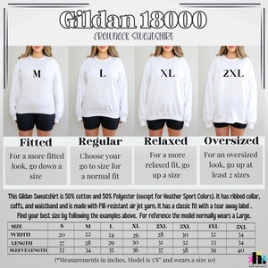 May include: White Gildan 18000 crewneck sweatshirt with size options M, L, XL, and 2XL. The image includes a size chart with measurements in inches and fit descriptions: Fitted, Regular, Relaxed, and Oversized.