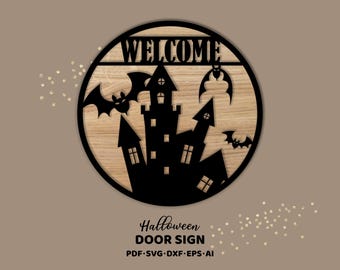 May include: A round wooden Halloween door sign with a black silhouette of a haunted house, bats, and the word "WELCOME" cut out at the top. The words "Halloween DOOR SIGN" are printed at the bottom.