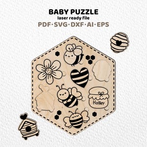 May include: Wooden baby puzzle with bee and honey-themed cutouts. The puzzle pieces include a flower, heart, honey pot, and bees. The text "BABY PUZZLE" and file type information are at the top.