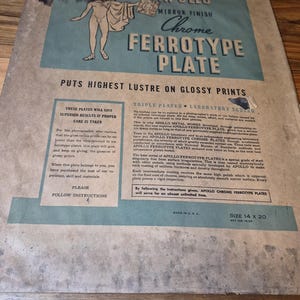 May include: Vintage Apollo Chrome Ferrotype Plate, size 14 x 20 inches, for glossy prints. The blue and beige packaging features a nude figure and text promoting superior results. Made in the U.S.A.