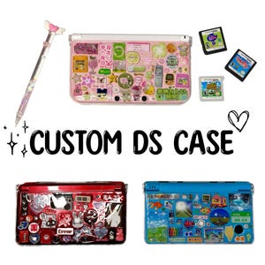 May include: A collection of custom DS cases in pink, red, and blue, adorned with stickers and charms. The image includes a stylus and several game cartridges. Text on the image reads "CUSTOM DS CASE".