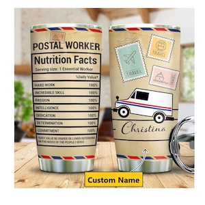 May include: A stainless steel tumbler with a brown and white design featuring a postal truck, stamps, and the text "POSTAL WORKER Nutrition Facts". The tumbler has a custom name, "Christina", printed on it.