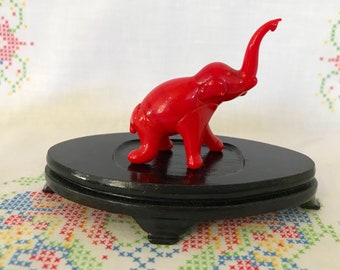 Adorable Vintage Red Glass Miniature Elephant.