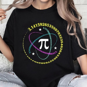 May include: Black t-shirt with a graphic of the mathematical constant pi, surrounded by a circle of numbers. The numbers are in a rainbow color scheme.