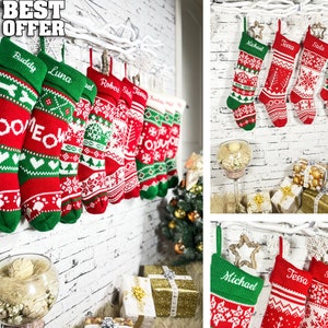 May include: Set of eight red and green Christmas stockings with white snowflake patterns. Each stocking has a personalized name embroidered on it: Buddy, Luna, Robey, Stella, Tessa, Michael, and Robert. The stockings are hanging on a white wooden branch.