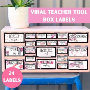 May include: A set of 24 pink and white labels for classroom storage boxes. The labels feature various school supplies, such as scissors, pencils, paper clips, and tape rolls. The labels are designed with a pink and white polka dot pattern and have a playful, whimsical style.