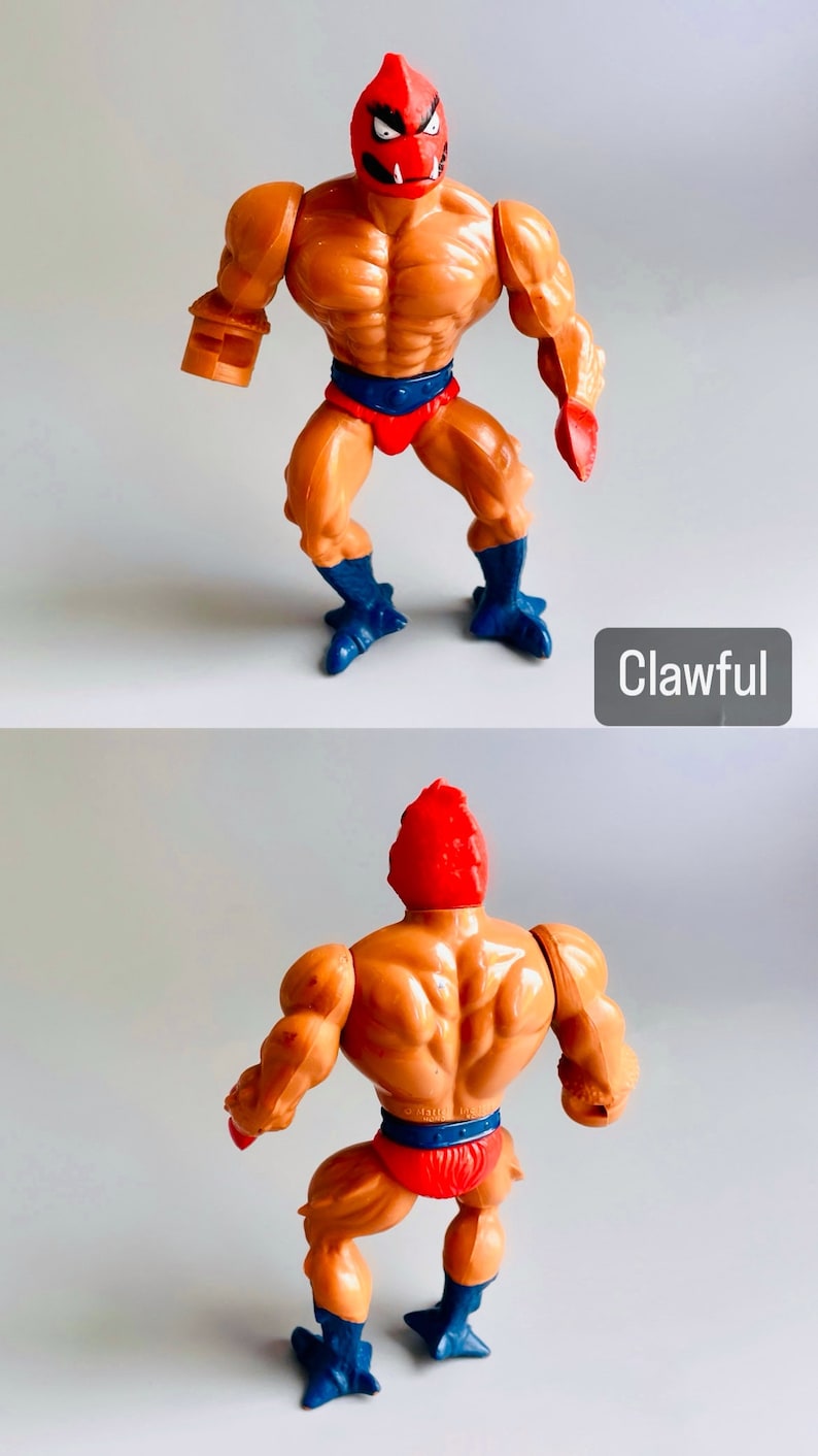 May include: Clawful, a vintage He-Man action figure with a red and orange head, orange body, red loincloth, and blue feet. The figure is posed in a standing position with arms outstretched.