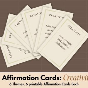 May include: A collection of cream-coloured affirmation cards, each bearing the word "CREATIVITY" at the top. Each card features a unique affirmation statement. The cards are arranged on a brown backdrop. The image includes text at the bottom: "6 Affirmation Cards: Creativity".