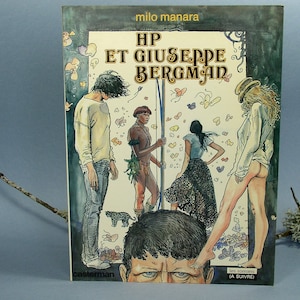 May include: A comic book cover featuring a colourful illustration of four people in a jungle setting. The title of the comic is "HP et Giuseppe Bergman" and the author is "Milo Manara".