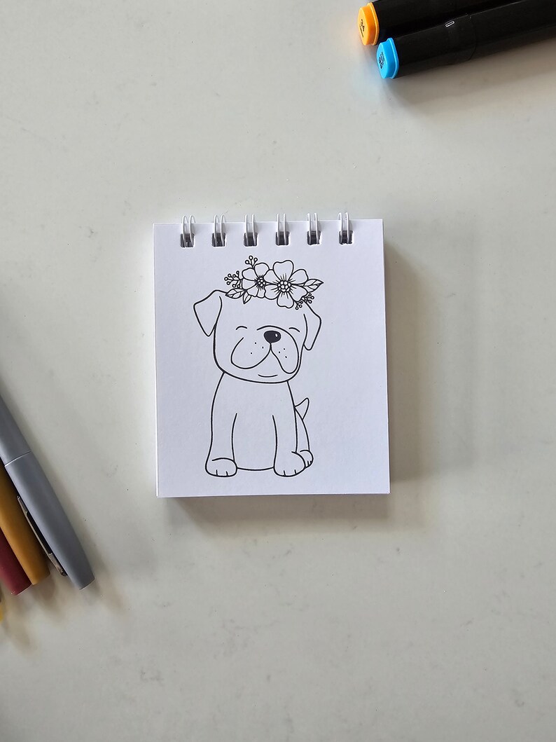 May include: A black and white line drawing of a dog wearing a flower crown. The dog is sitting with its legs crossed and has a happy expression on its face.