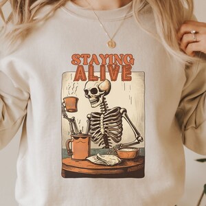 Staying Alive Sweatshirt, Funny Halloween Staying Alive Skeleton Sweatshirt, Skeleton Halloween Sweatshirt, Funny Coffee Lover Sweatshirt