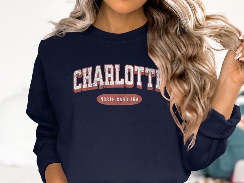 Navy sweatshirt with "Charlotte North Carolina" in distressed white lettering.