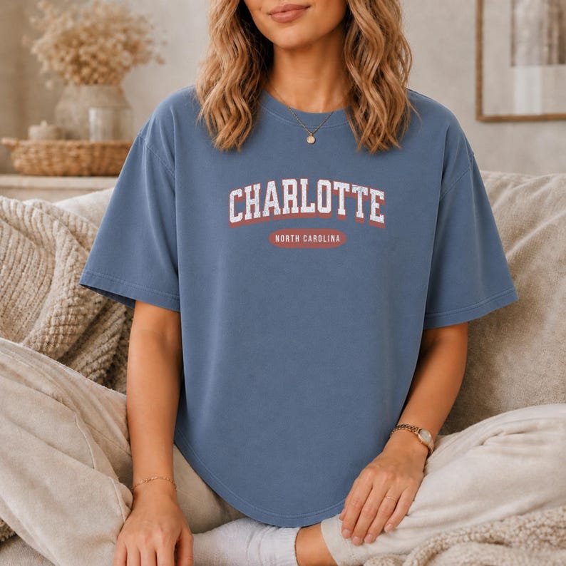 Blue t-shirt with "Charlotte North Carolina" text.