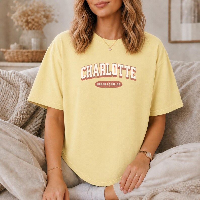 Yellow t-shirt with "Charlotte North Carolina" text.