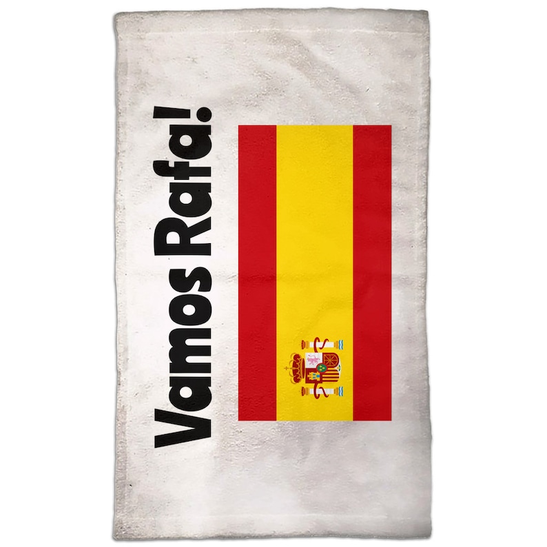 May include: White towel with the Spanish flag and the text "Vamos Rafa!" in black.