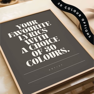 May include: A framed art print with the text "YOUR FAVOURITE LYRICS WITH A CHOICE OF 30 COLOURS" in white on a dark gray background. The print is in a light wood frame. The image also includes the text "30 COLOUR OPTIONS".