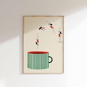 May include: Art print featuring a large green and white striped coffee mug with a red rim and black handle. Above the mug, stylized figures in red swimsuits are depicted diving into the mug.