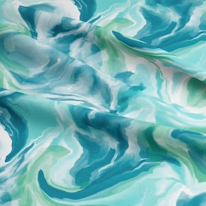 May include: A fabric featuring a fluid, watercolour-style design in teal, turquoise, green, and white. The pattern mimics swirling water or marble, with gentle colour transitions. The fabric is folded, highlighting its texture and drape.